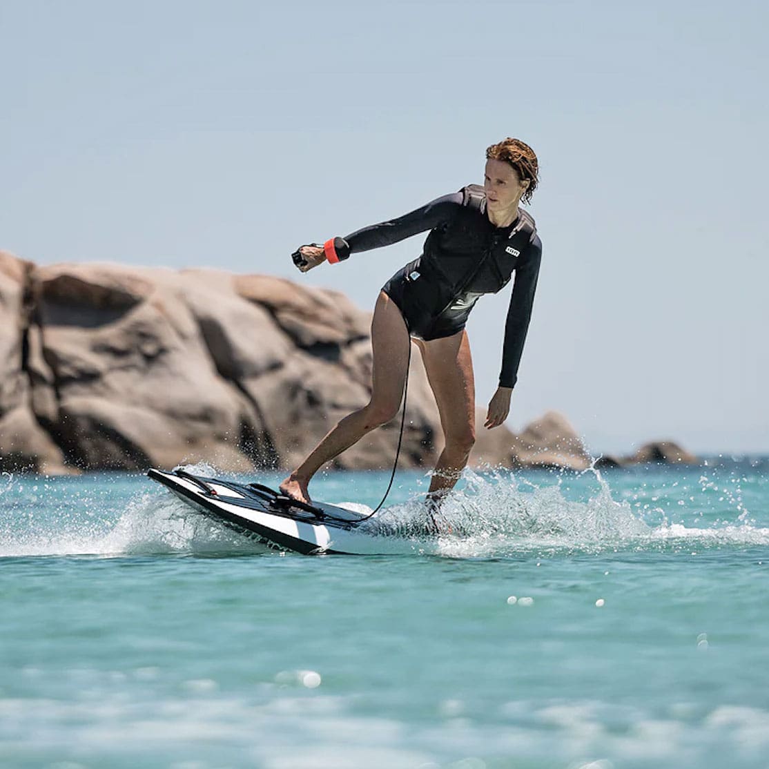 A woman gliding on a Fliteboard in the ocean.