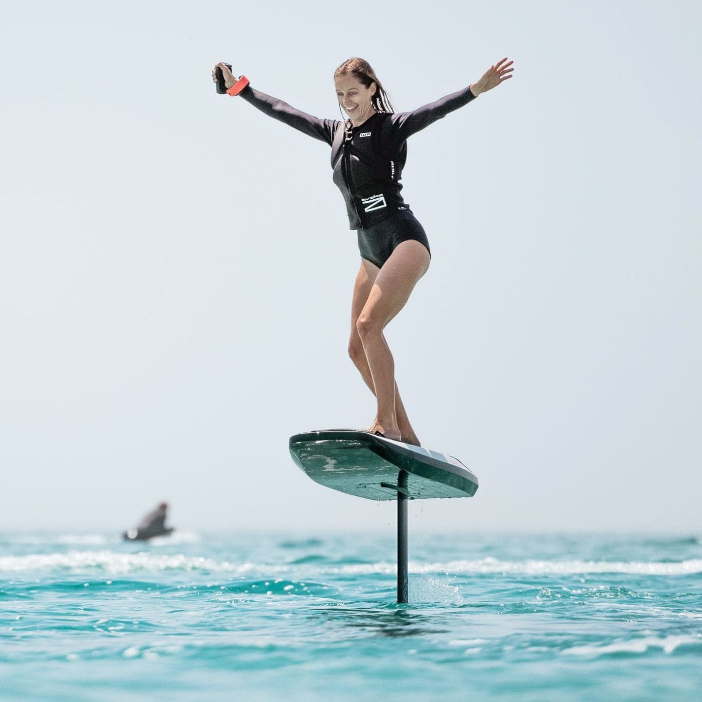 A woman gliding on a Fliteboard in the ocean.