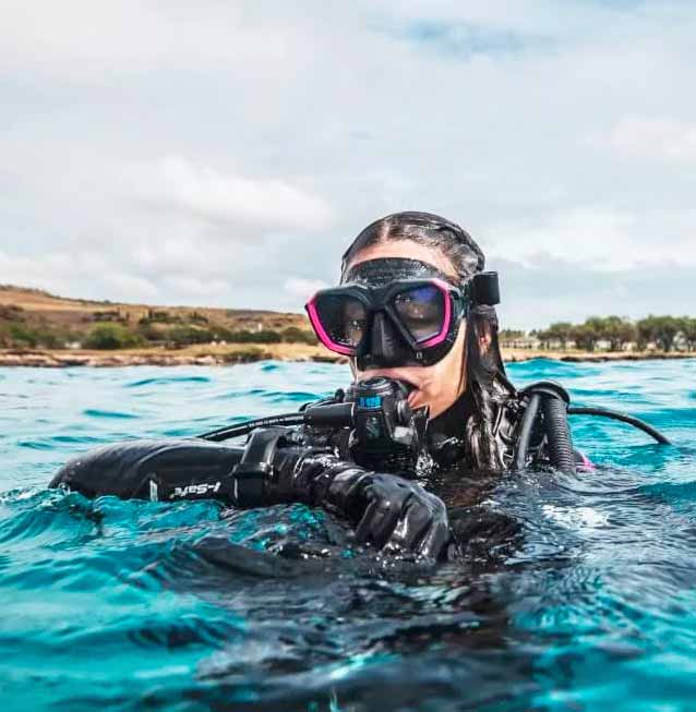 Scubapro Person riding a hydrofoil bike on a lake