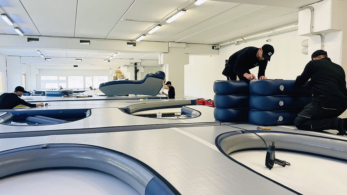 A team producing inflatables made from Thermoplastic Polyurethane in a spacious workshop
