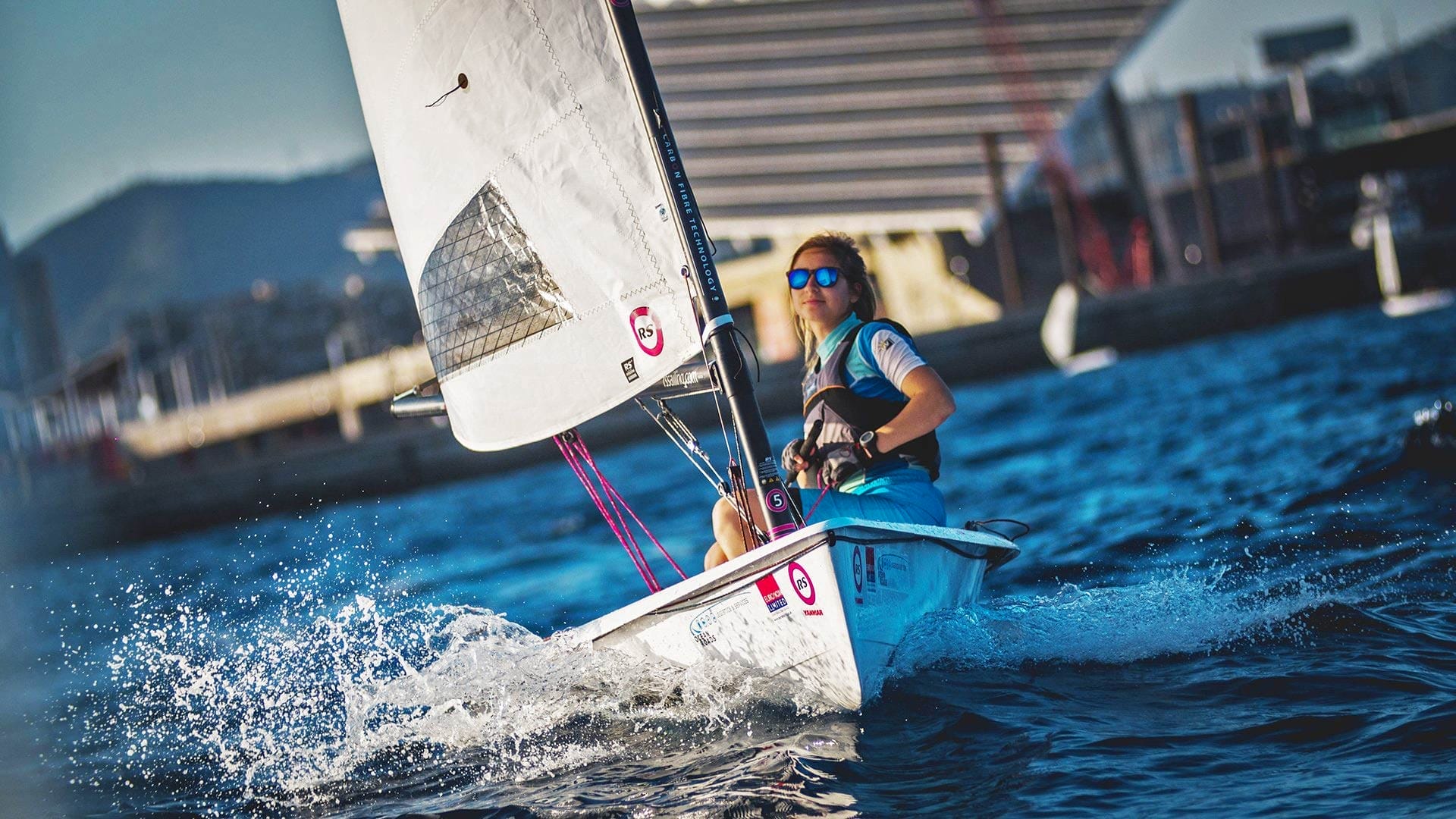 RS Sailing A man riding the Awake RÄVIK 3 surfboard in the water.